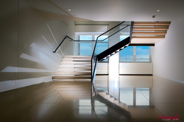 Prominent staircase in office dramatically lit photograph London Architectural Photographer