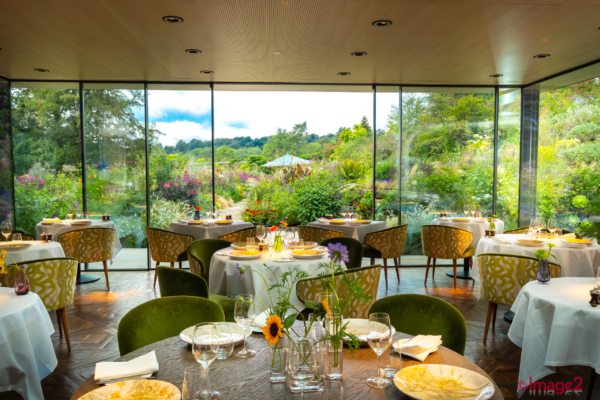 Interior photograph hotel restaurant with lovely glass overlooking Hotel garden. Sussex Property photographer