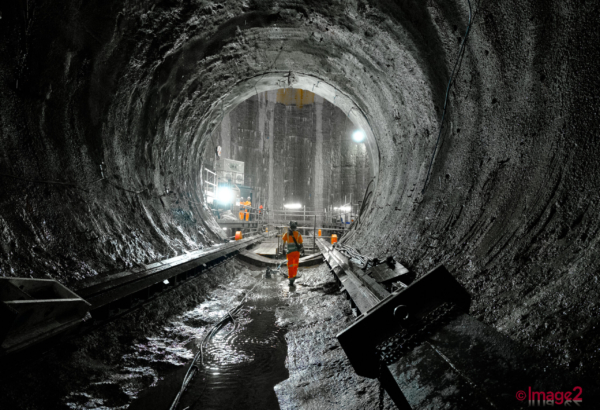 Lone construction worker walking through one of the tunnels London Construction photographer.