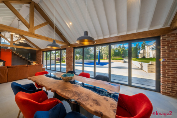 interior image of contemporary extension overlooking swimming pool. Cambridgeshire Property photographer