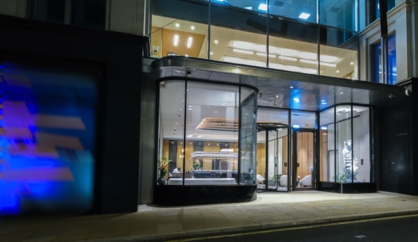 Bespoke curved bay windows photographed at night of a London office